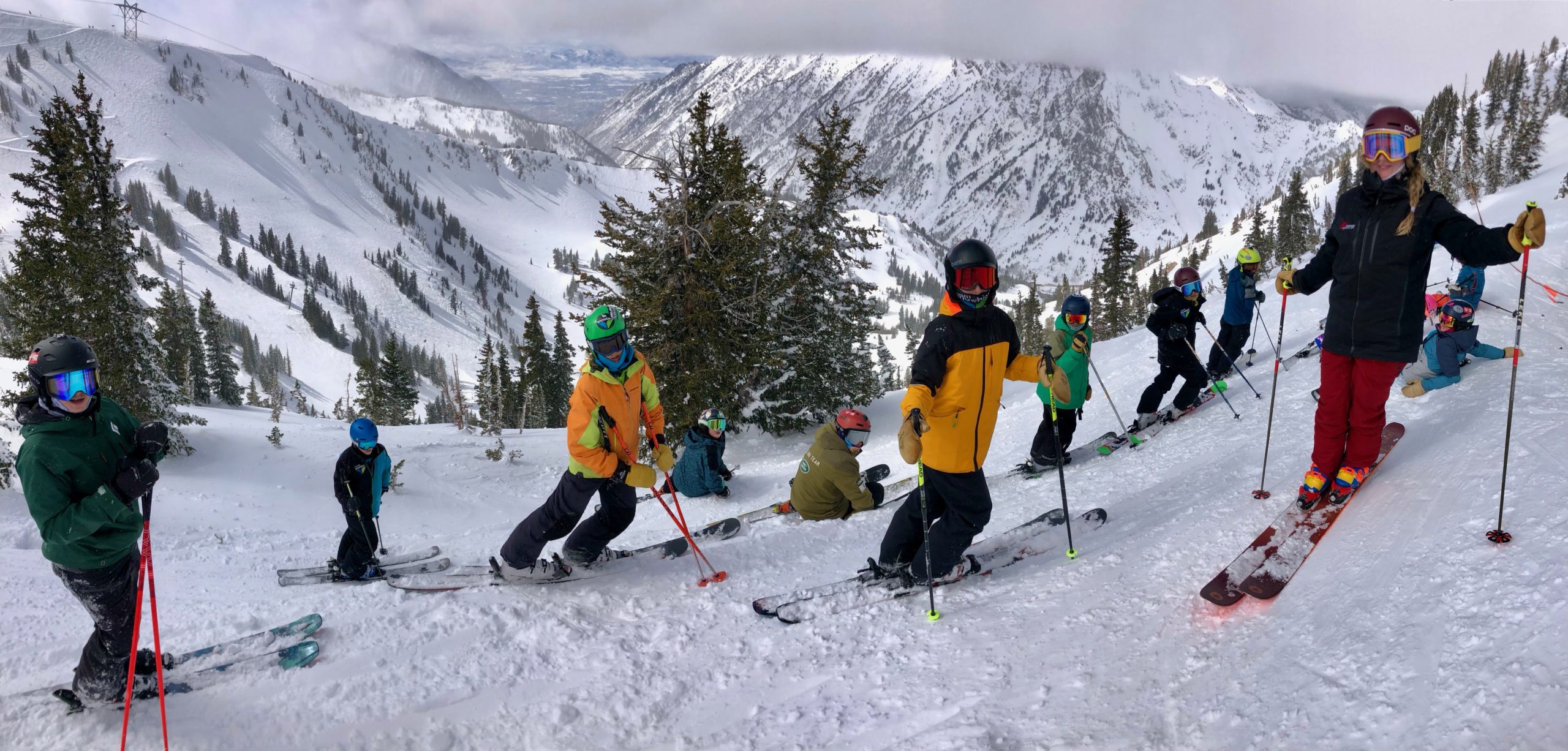 Group of skiers on snowy mountain slope