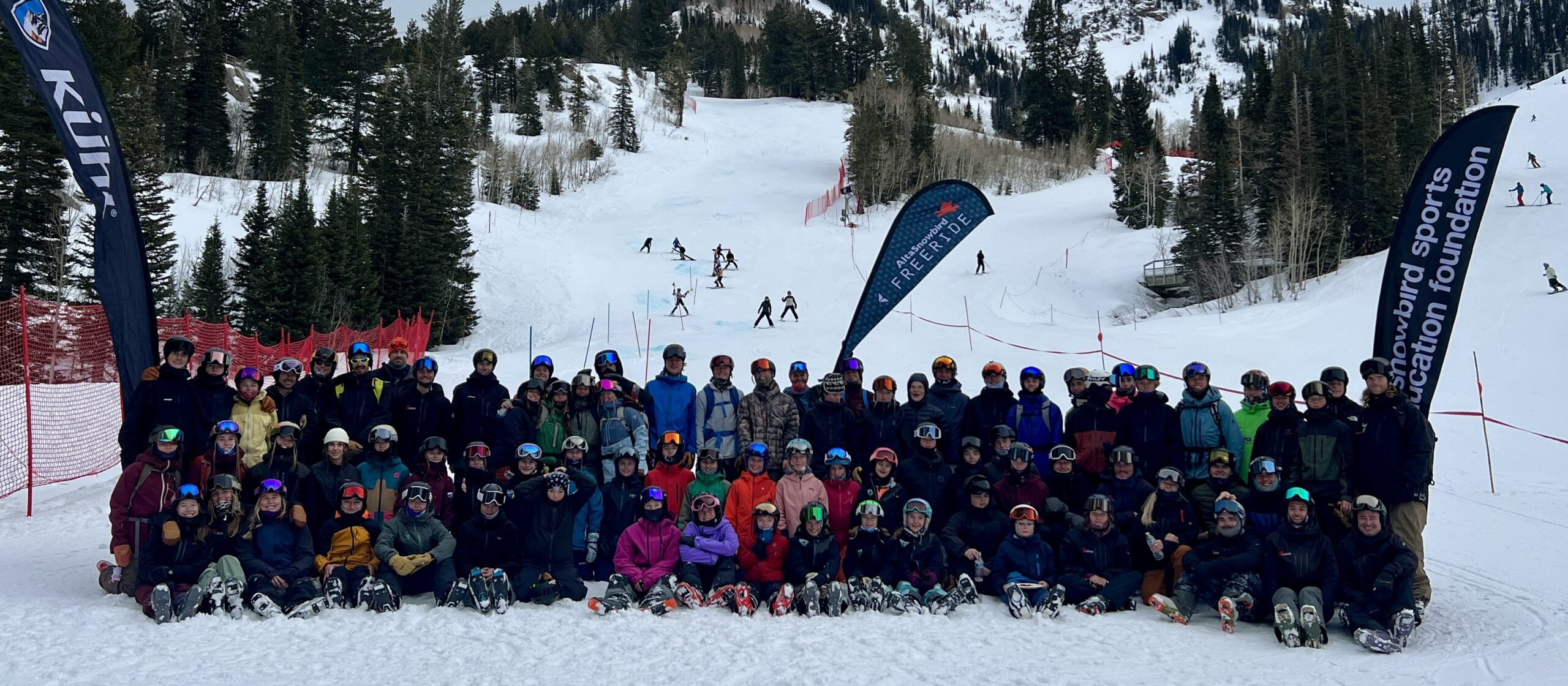 Large group of skiers on snowy slope