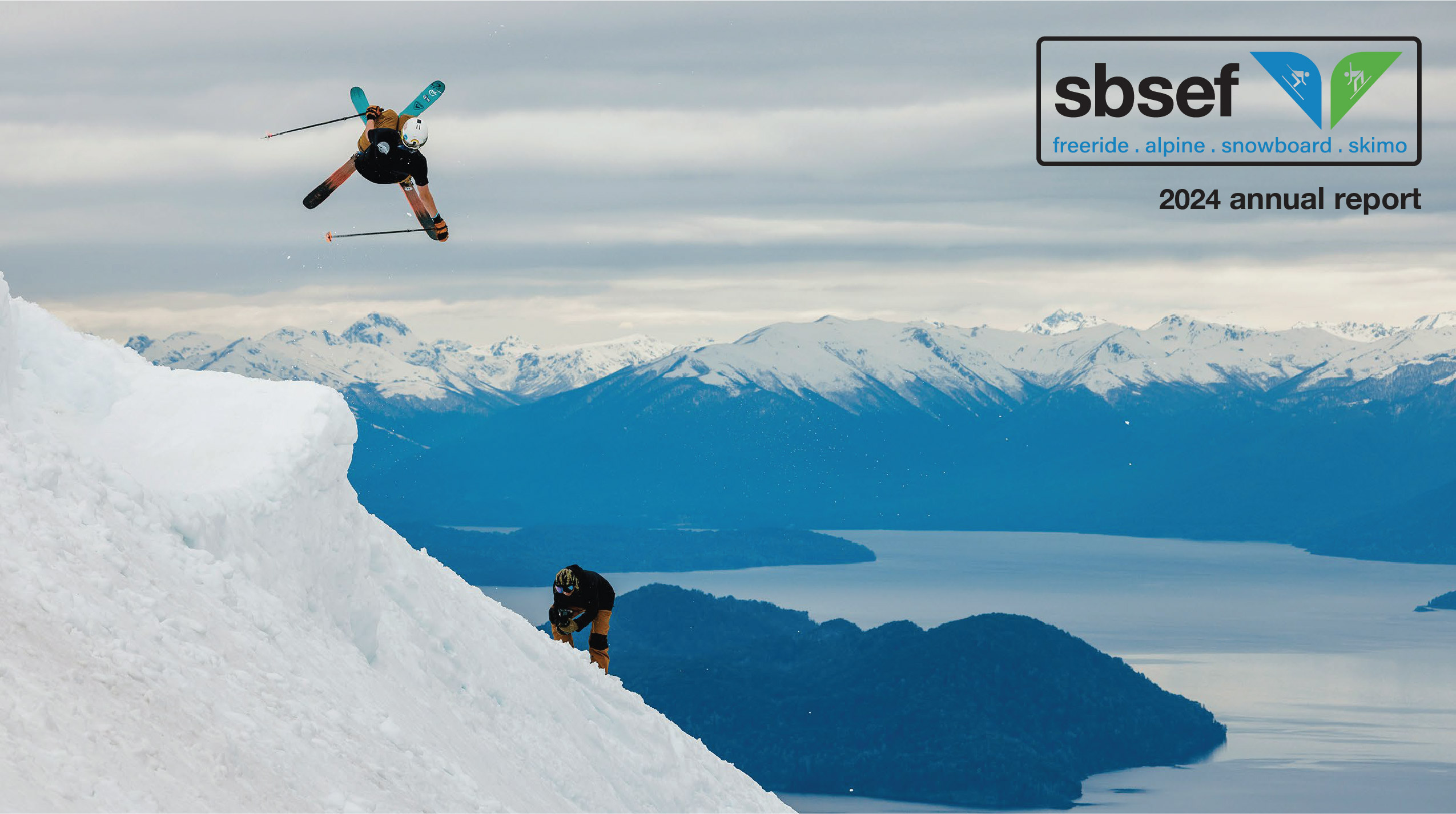 Skier performing aerial trick over snowy slope